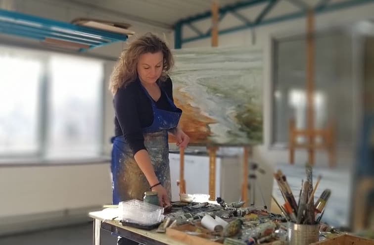 Astrid Stoffels painting in her studio